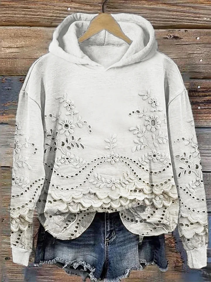 Dārta Floral Hoodie – sieviešu kapuces džemperis ar izsmalcinātu ziedu izšuvumu