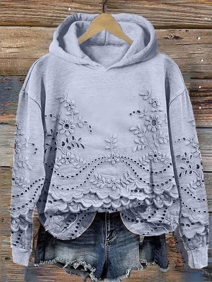 Dārta Floral Hoodie – sieviešu kapuces džemperis ar izsmalcinātu ziedu izšuvumu
